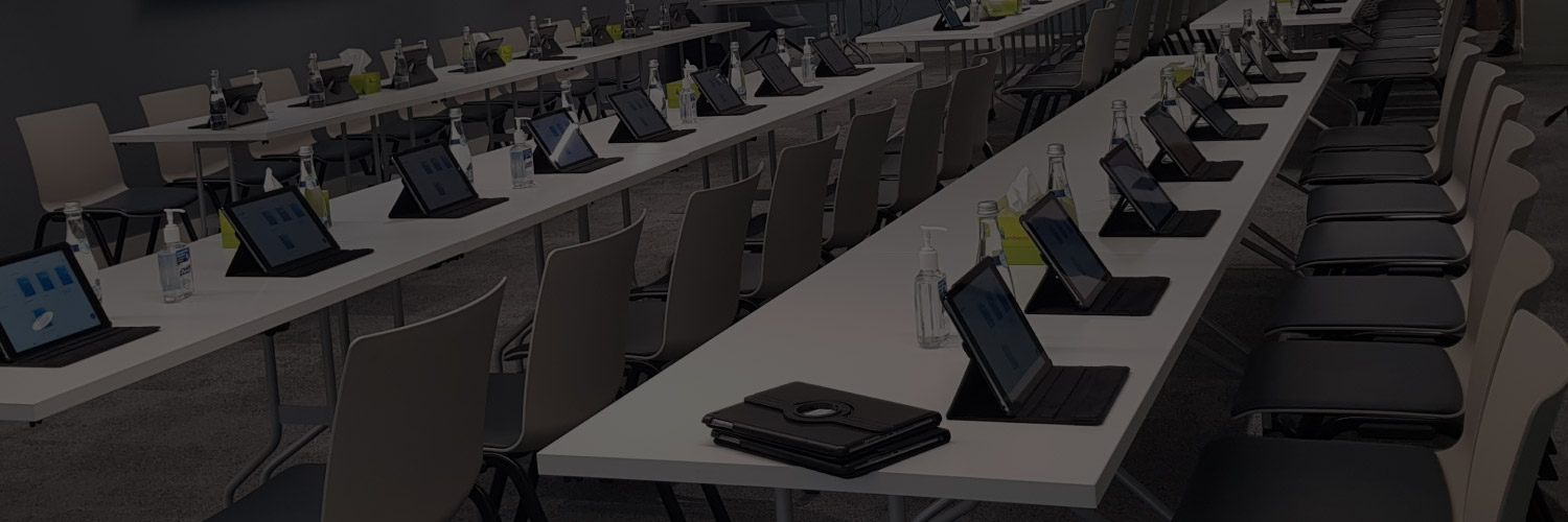 iPads arranged on conference tables for a professional meeting, conference, or corporate event.