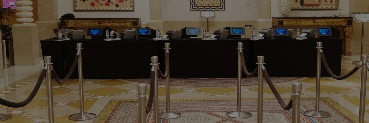 Conference check-in station with badge printers and registration counters